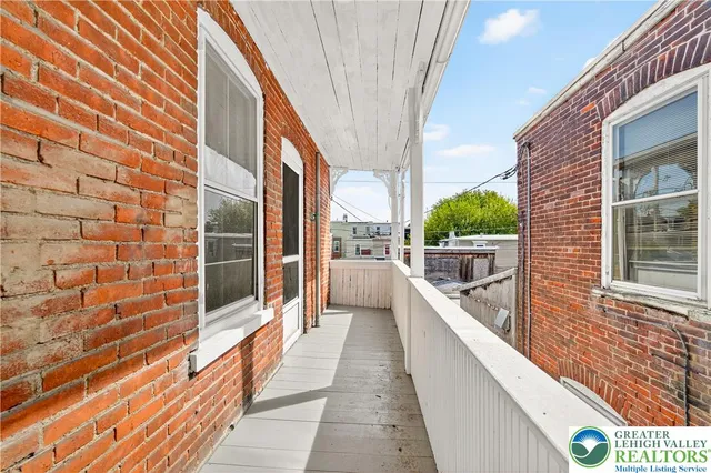 a view of a hallway with staircase