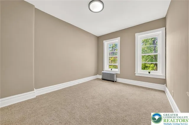 an empty room with windows