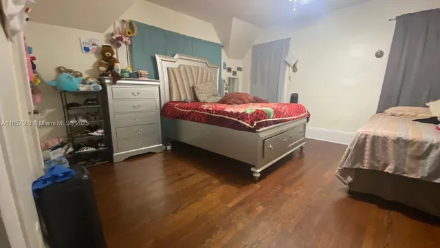 a bedroom with a bed and a closet