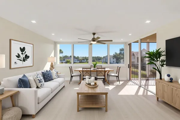 a view of a dining room with furniture window and wooden floor