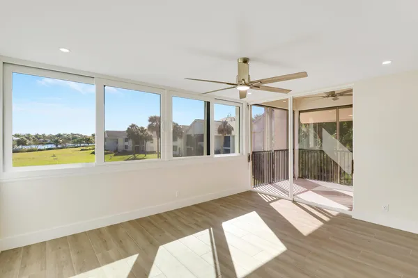 a kitchen with a refrigerator and a sink