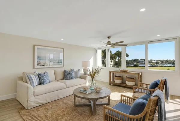 a kitchen with stainless steel appliances granite countertop a sink a stove and a refrigerator