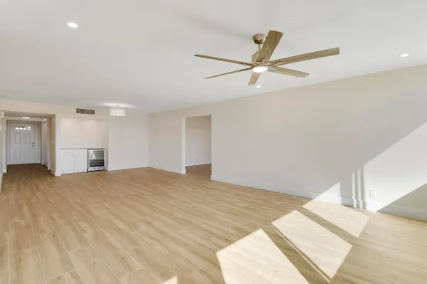 a kitchen with stainless steel appliances granite countertop a sink a stove and a refrigerator