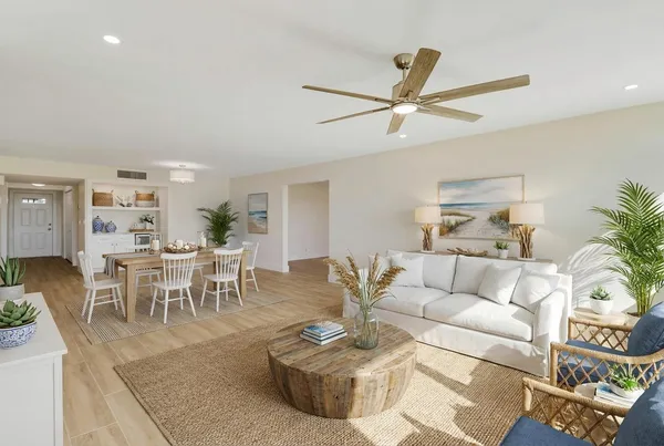 a kitchen with stainless steel appliances granite countertop a sink a stove and a refrigerator