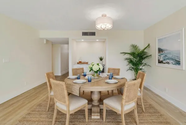 a spacious bedroom with a bed and a large window