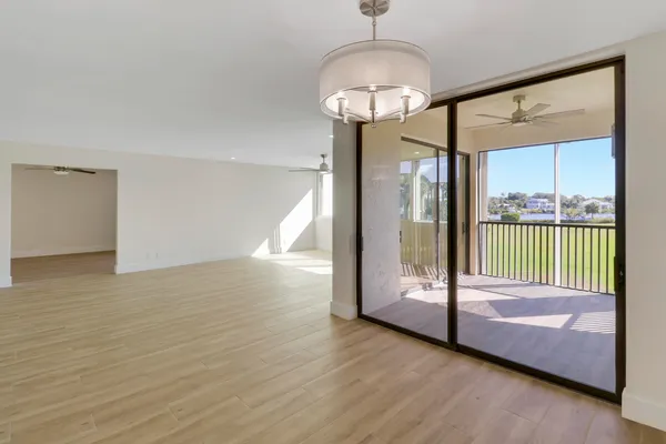a bedroom with a large bed and a large window