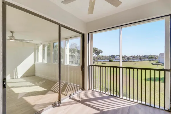 a bathroom with a granite countertop double vanity sink and a mirror