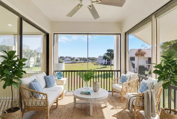 a bathroom with a granite countertop double vanity sink and mirror