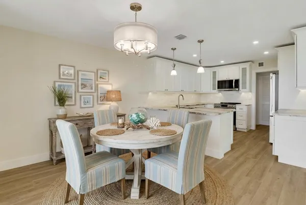 an empty room with wooden floor a ceiling fan and closet