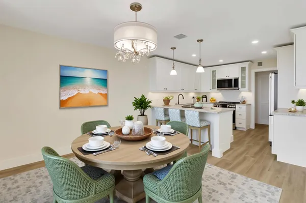 a living room with furniture a flat screen tv and a large window