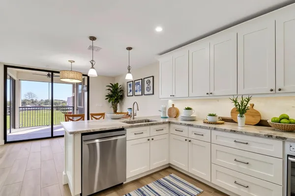 a bathroom with a granite countertop sink a toilet and a bathtub