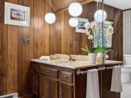 a kitchen with a table and a chandelier