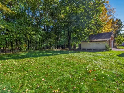 a house view with a sitting space and garden