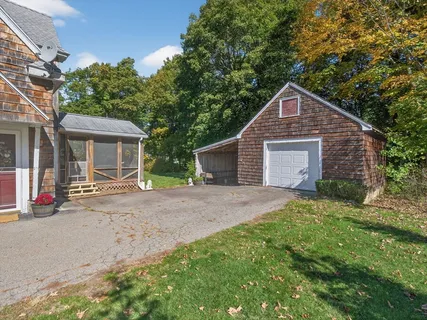 an aerial view of a house with a yard