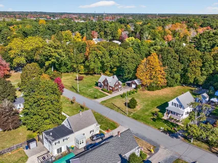 a picture of a book and a white bed