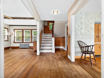 a view of a livingroom with furniture and wooden floor