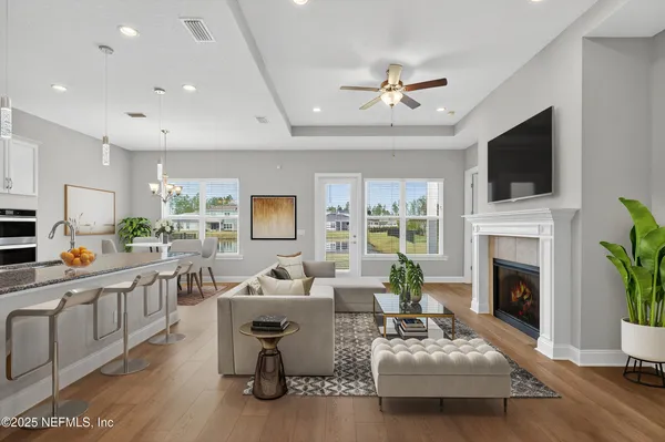 a living room with furniture fireplace and a flat screen tv