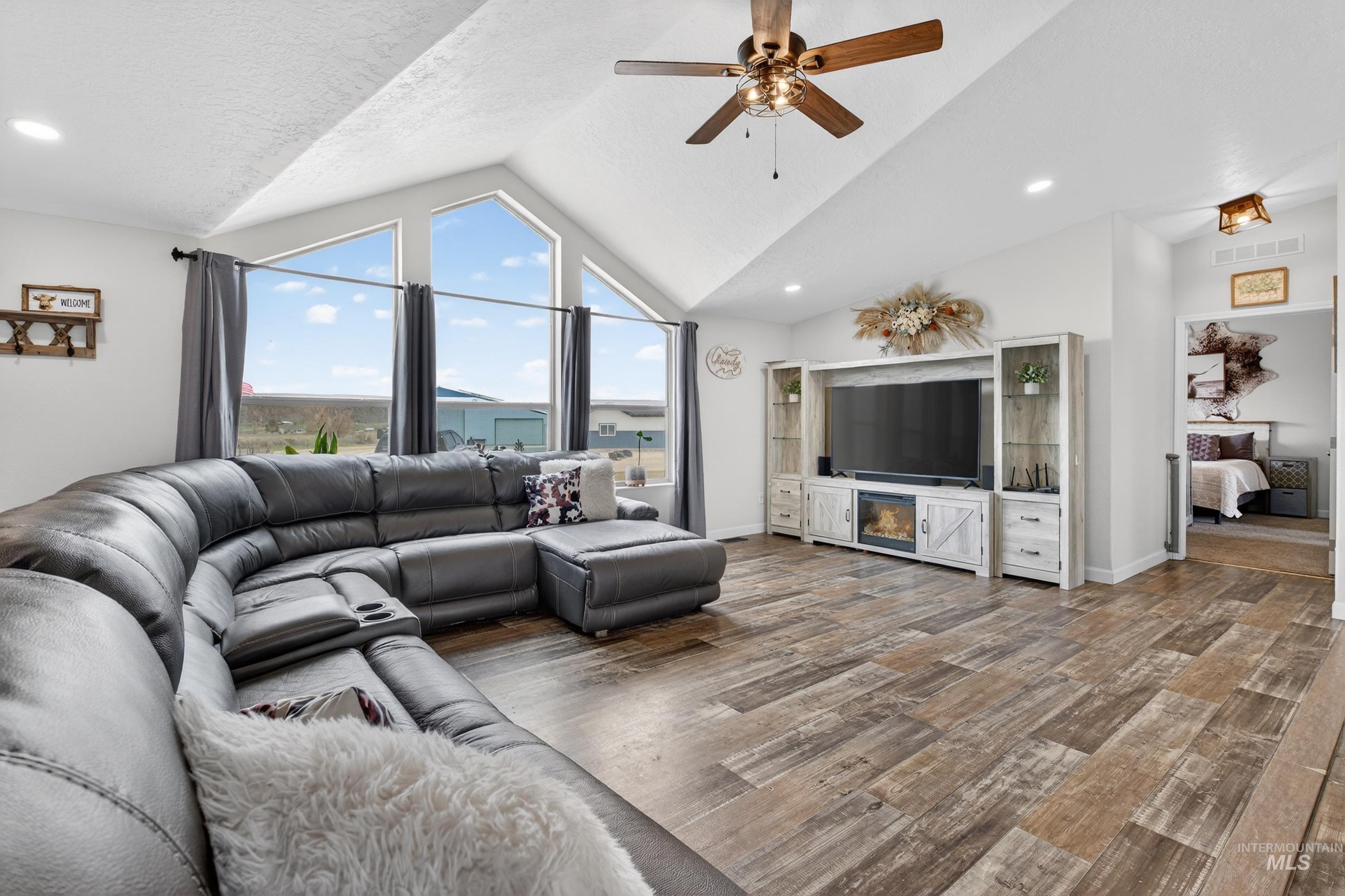 728 Chase Lane Melba, ID 83641 - Photo 12 of 48 Living area with ceiling fan, wood finished floors, and recessed lighting