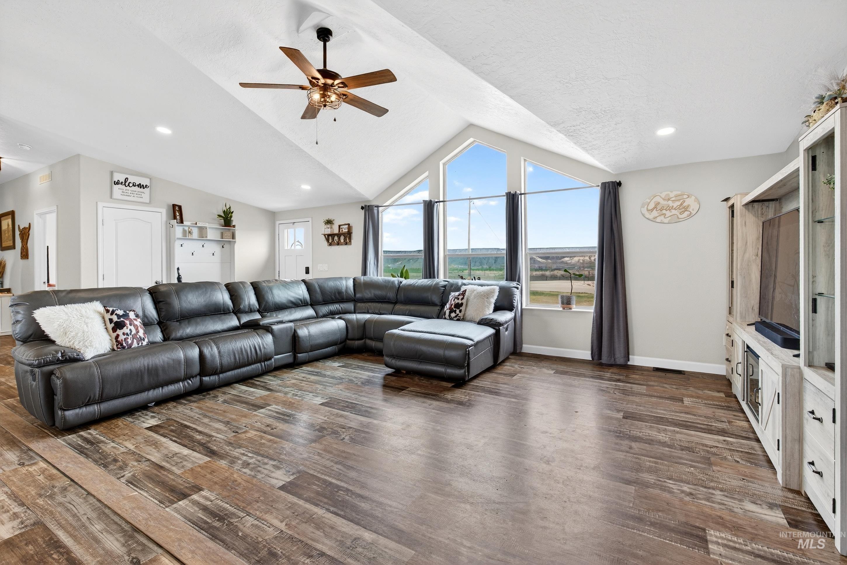 728 Chase Lane Melba, ID 83641 - Photo 13 of 48 Living room with ceiling fan, dark wood-style floors, and recessed lighting