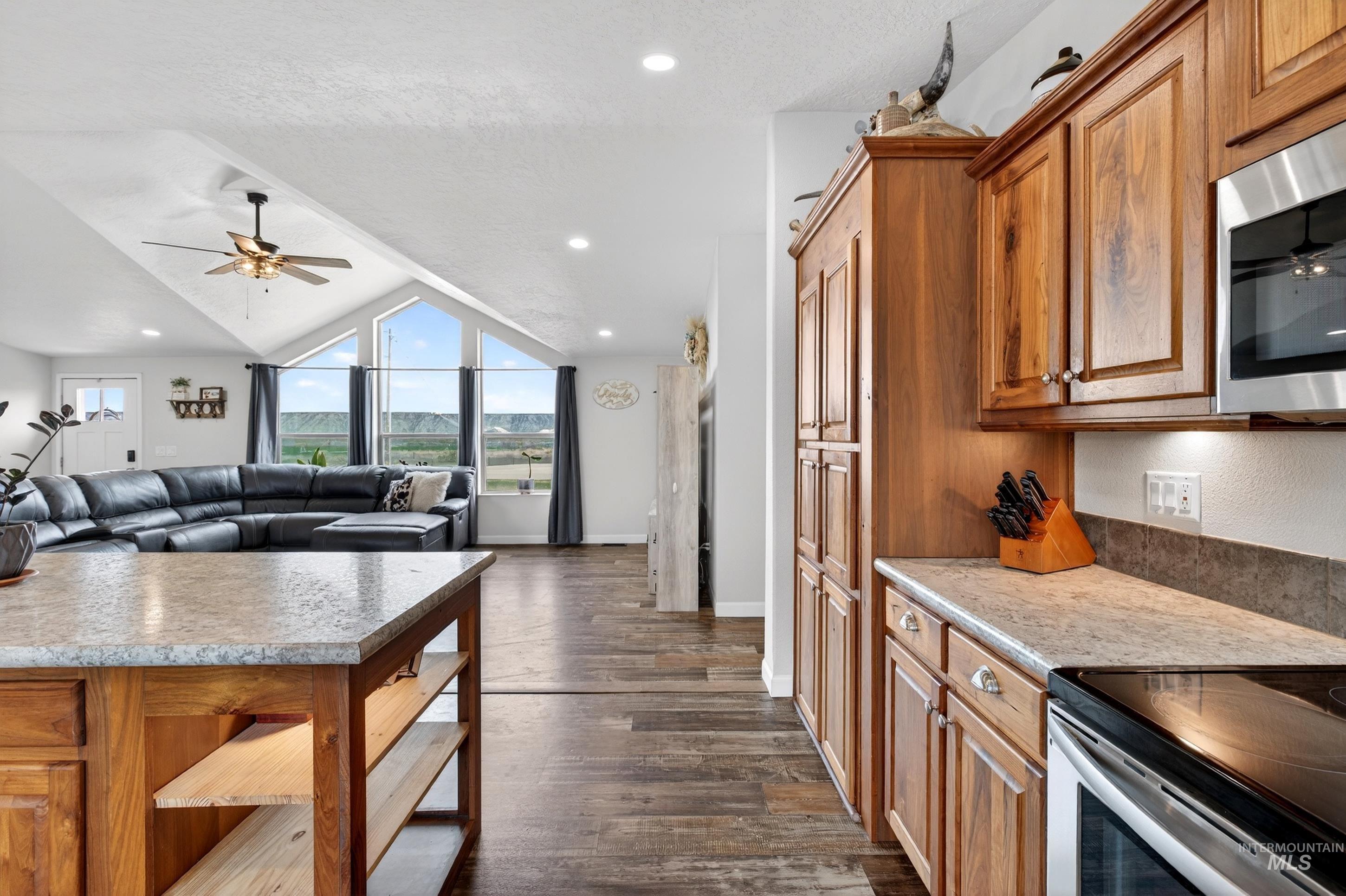 728 Chase Lane Melba, ID 83641 - Photo 18 of 48 Kitchen featuring a ceiling fan, stainless steel appliances, wood finish cabinetry, light countertops, and recessed lighting