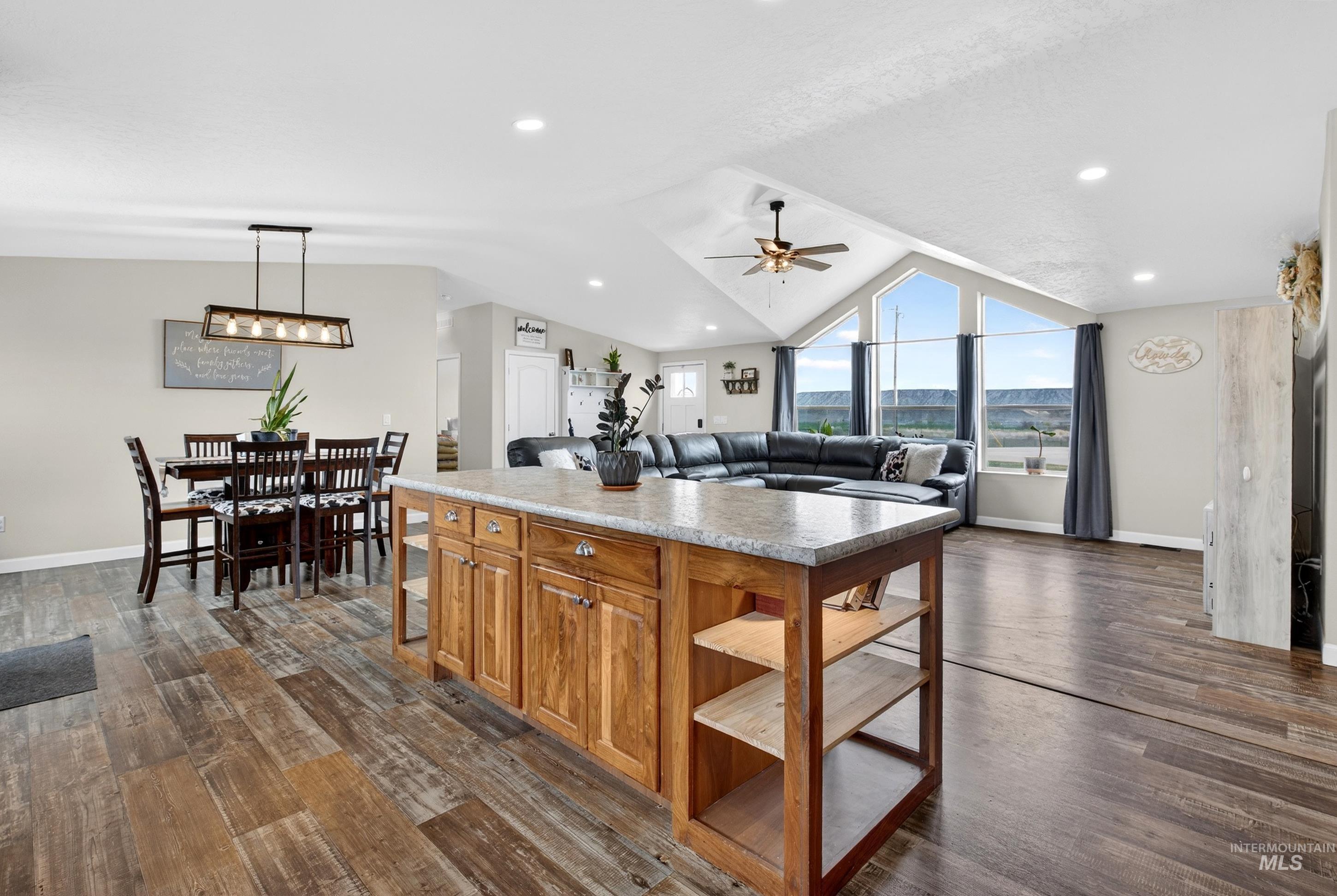 728 Chase Lane Melba, ID 83641 - Photo 48 of 48 Kitchen with wood finish cabinetry, dark wood finished floors, open floor plan, and a ceiling fan