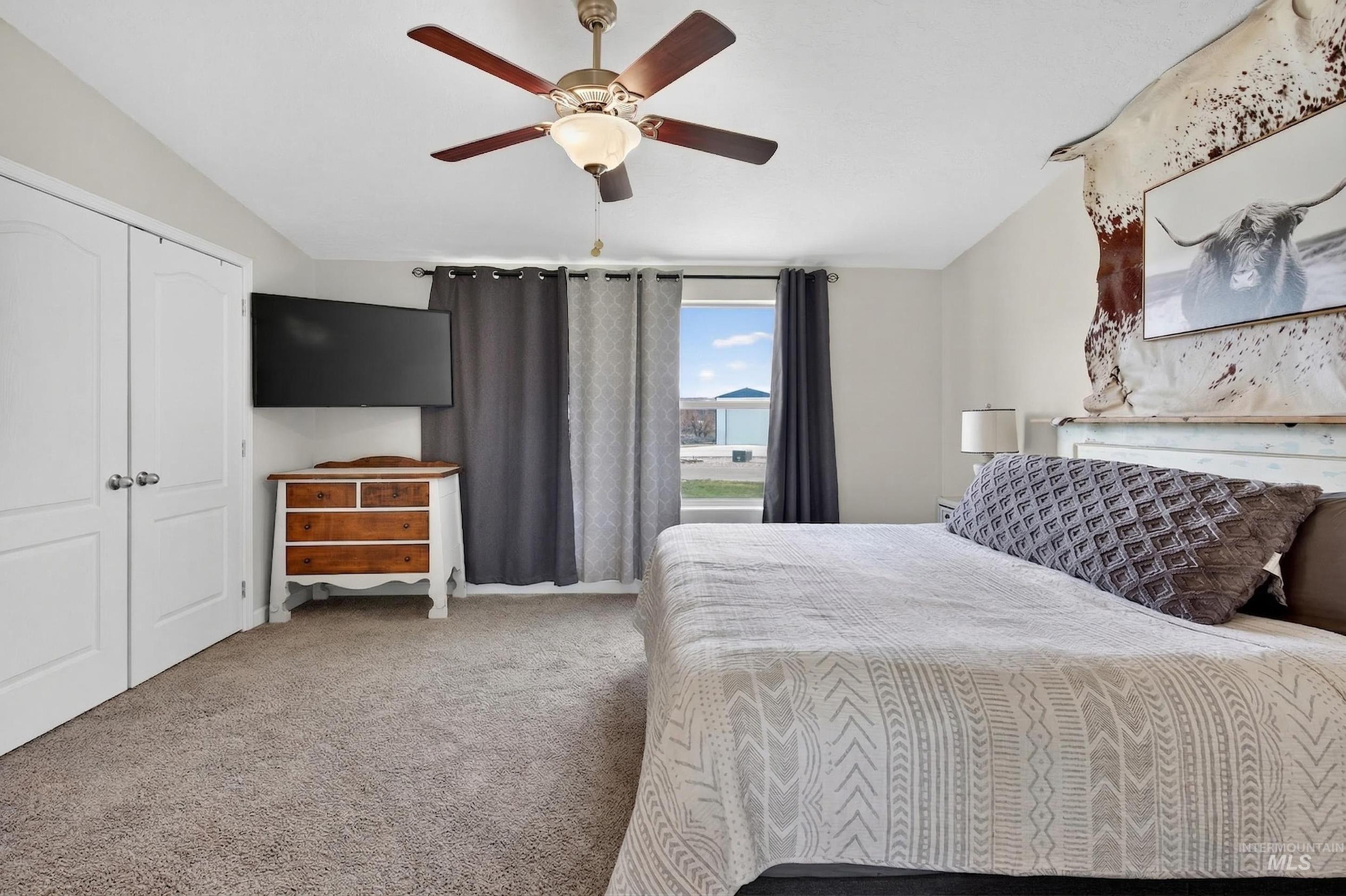 728 Chase Lane Melba, ID 83641 - Photo 23 of 48 Carpeted bedroom with ceiling fan and a closet