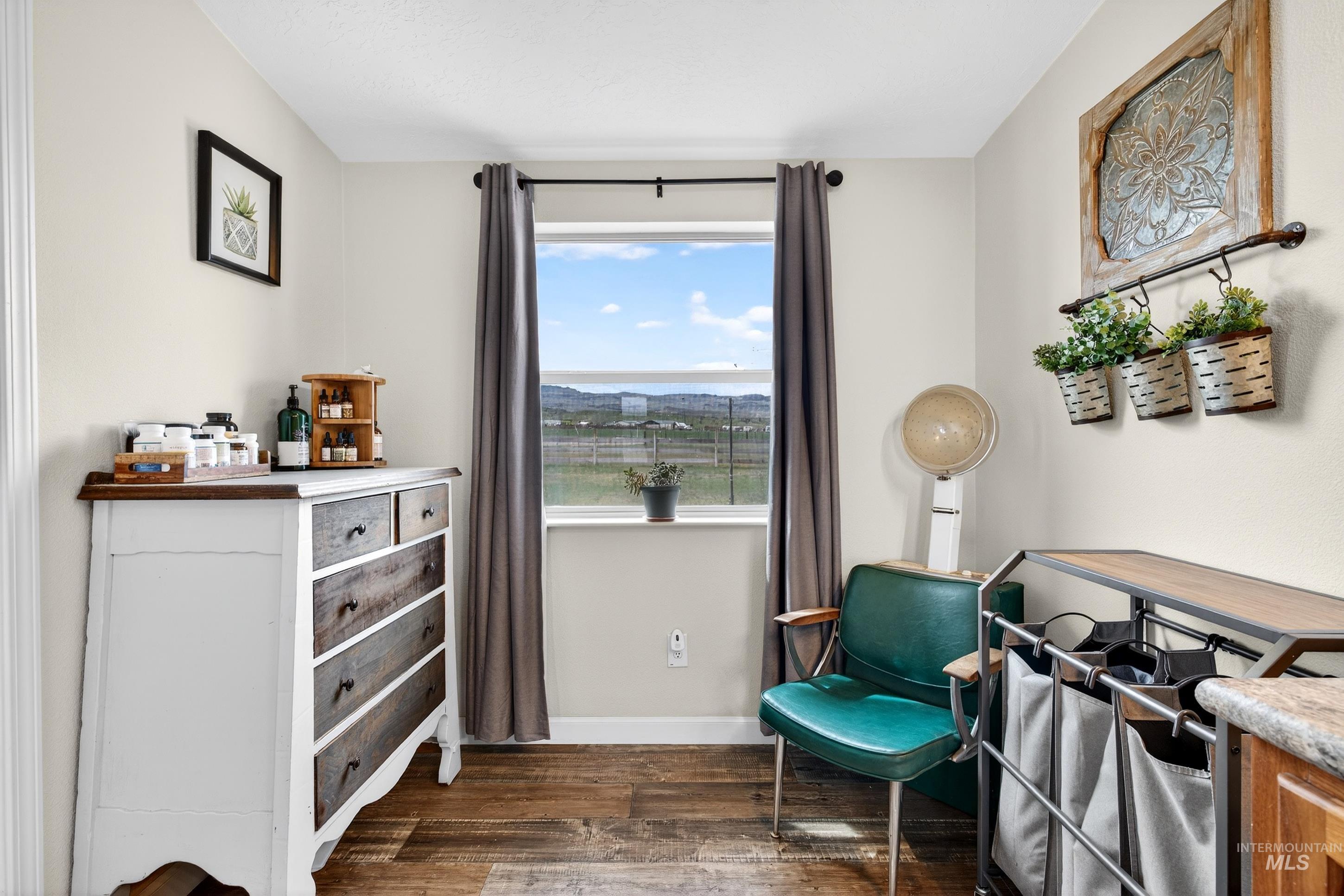 728 Chase Lane Melba, ID 83641 - Photo 25 of 48 Sitting room with dark wood-style flooring and baseboards