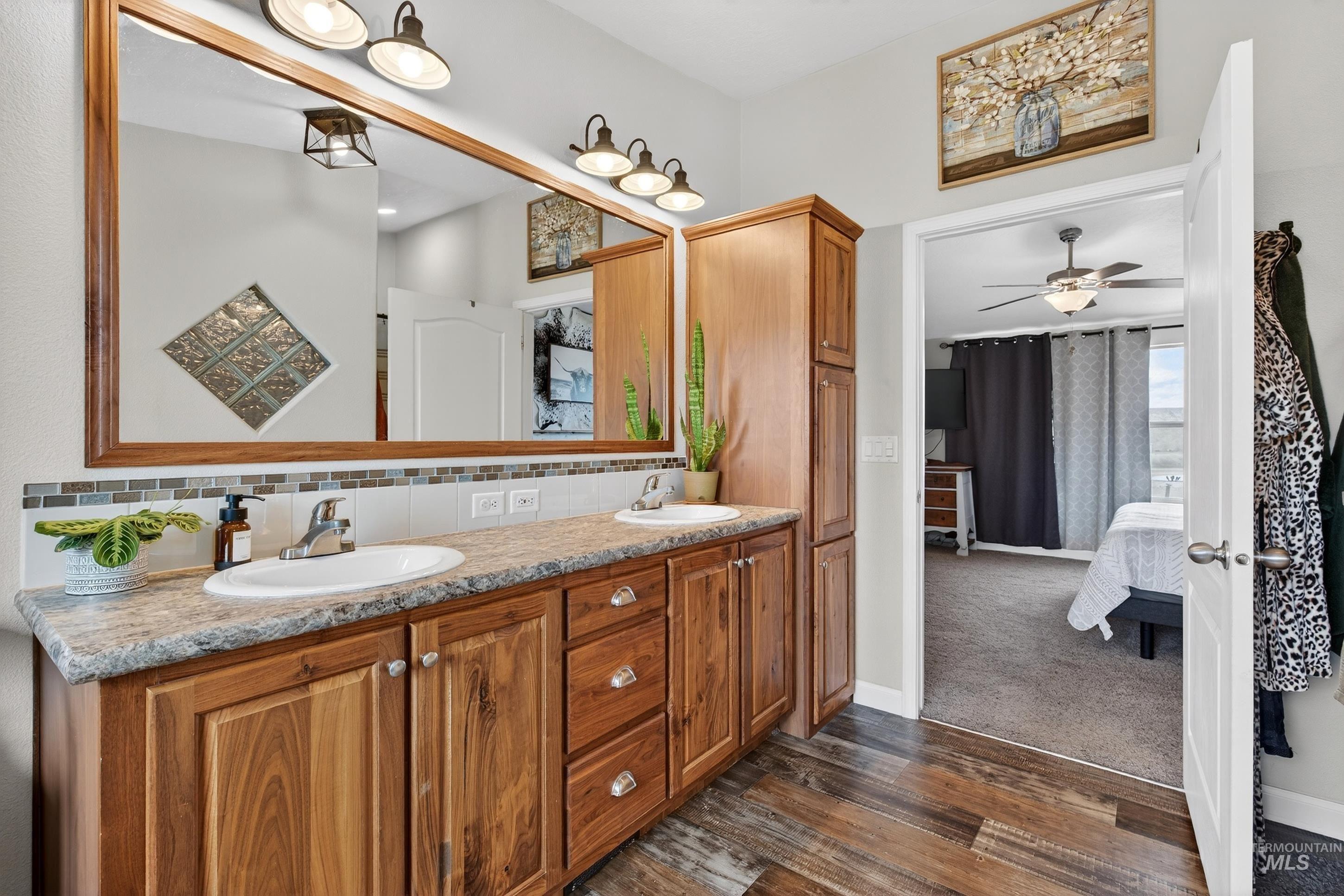 728 Chase Lane Melba, ID 83641 - Photo 26 of 48 Bathroom featuring ensuite bathroom, double vanity, decorative backsplash, dark wood-style flooring, and ceiling fan