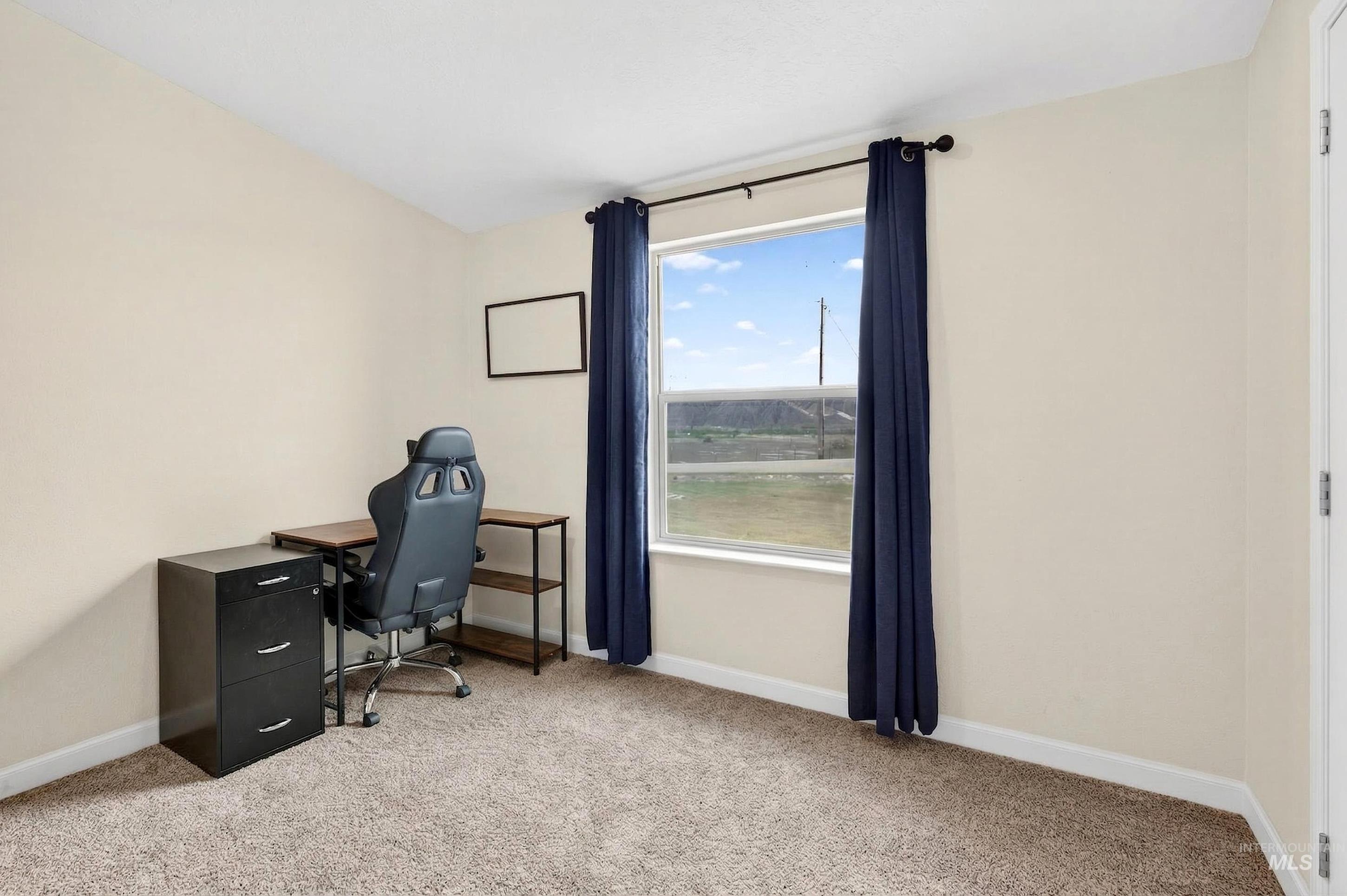 728 Chase Lane Melba, ID 83641 - Photo 28 of 48 Home office with baseboards and light colored carpet