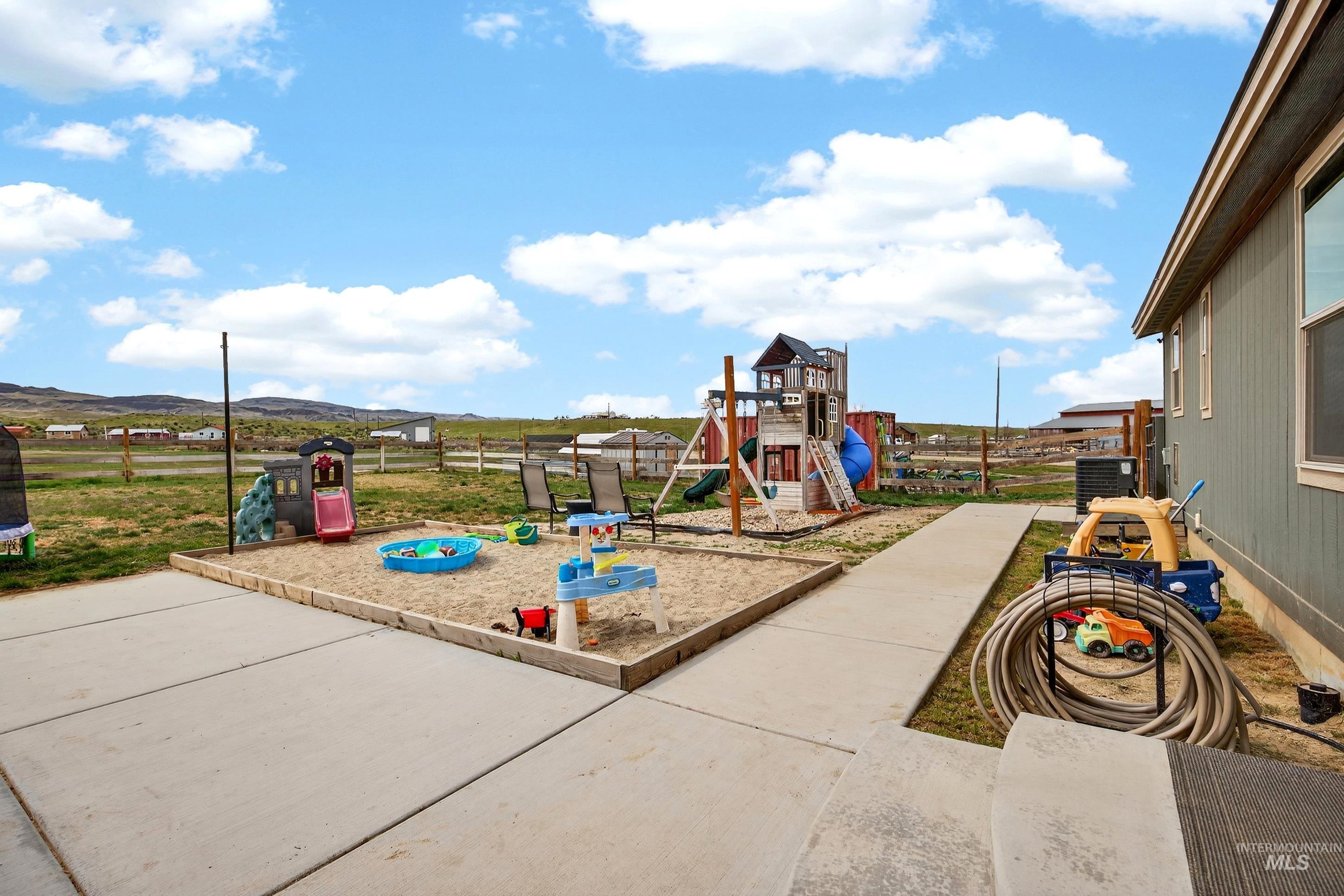 728 Chase Lane Melba, ID 83641 - Photo 36 of 48 View of jungle gym with a patio