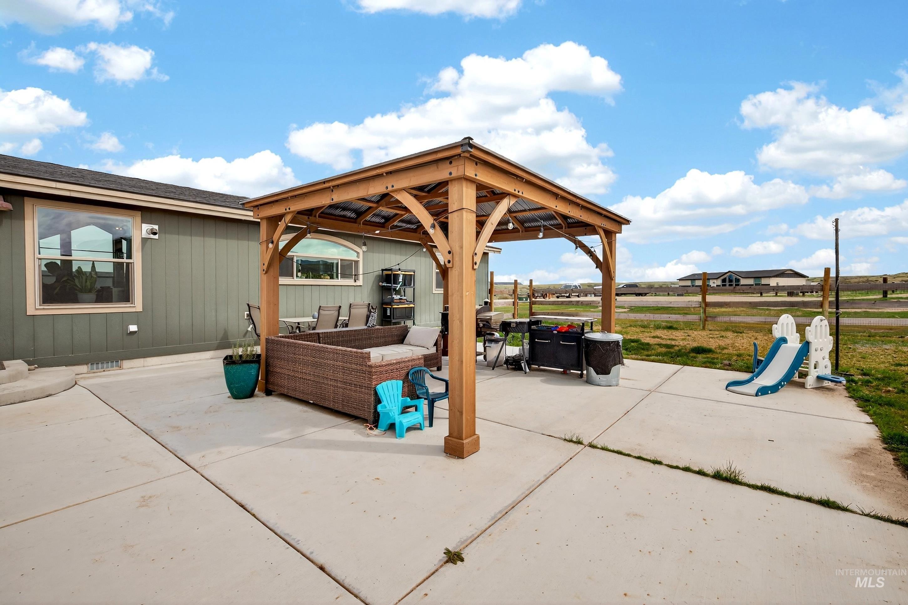 728 Chase Lane Melba, ID 83641 - Photo 37 of 48 View of patio / terrace with outdoor furniture and a gazebo
