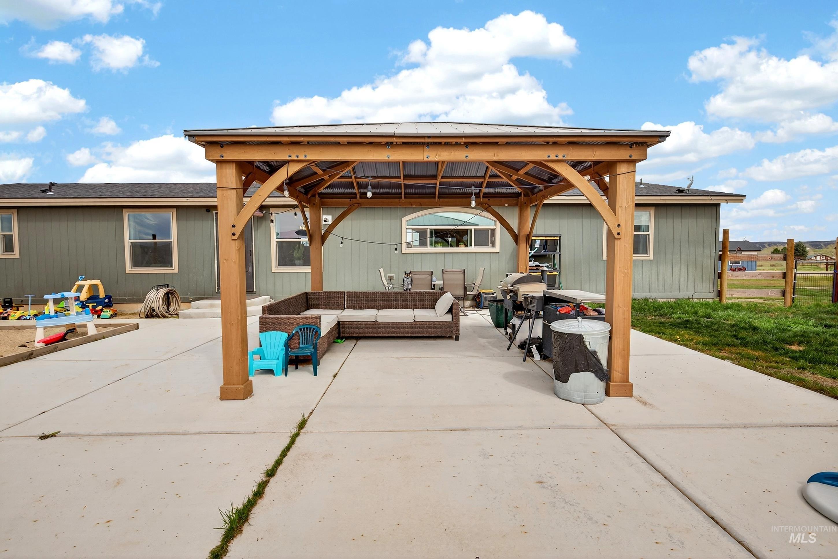 728 Chase Lane Melba, ID 83641 - Photo 38 of 48 View of patio featuring an outdoor living space and a gazebo