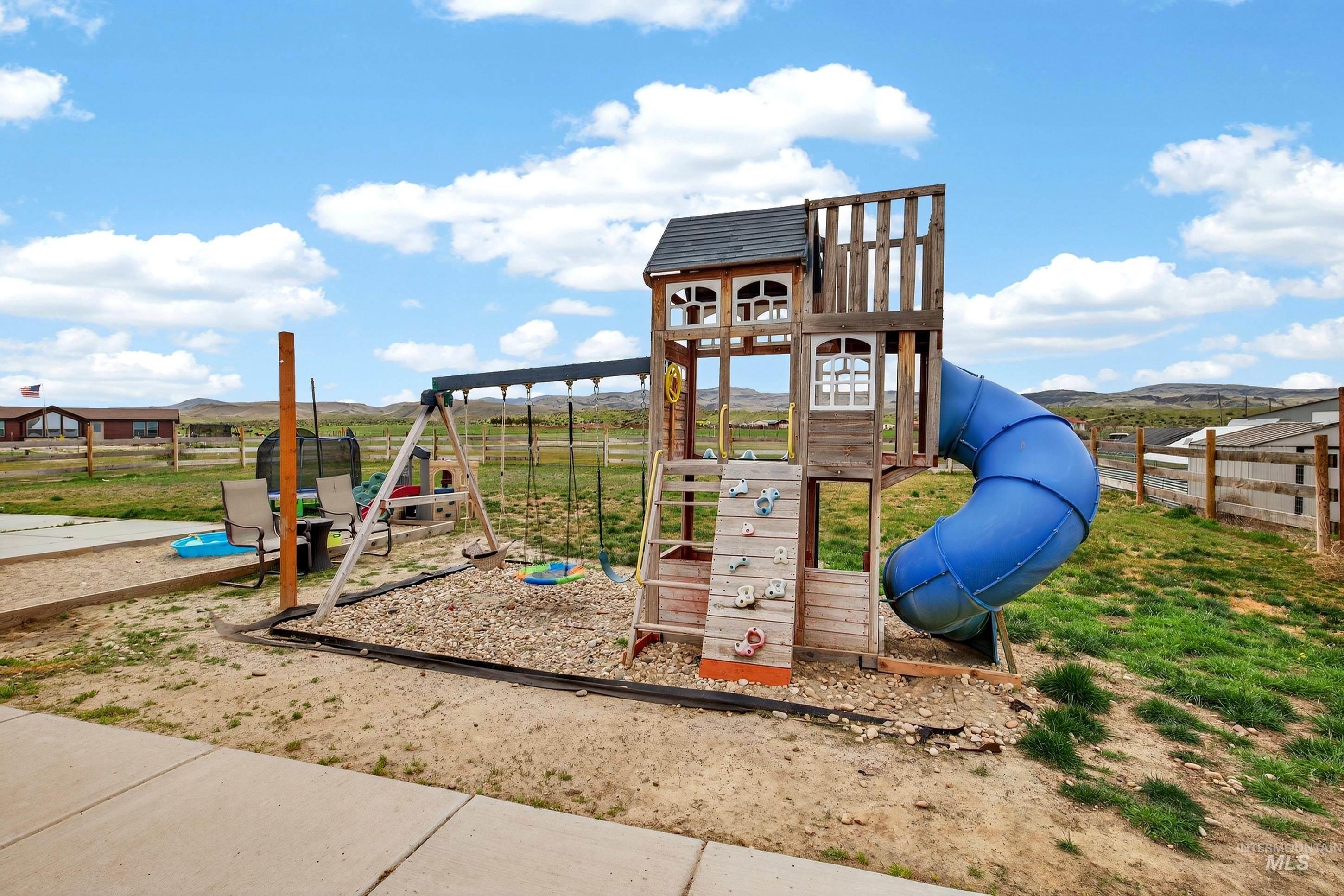 728 Chase Lane Melba, ID 83641 - Photo 41 of 48 View of jungle gym featuring a mountain view