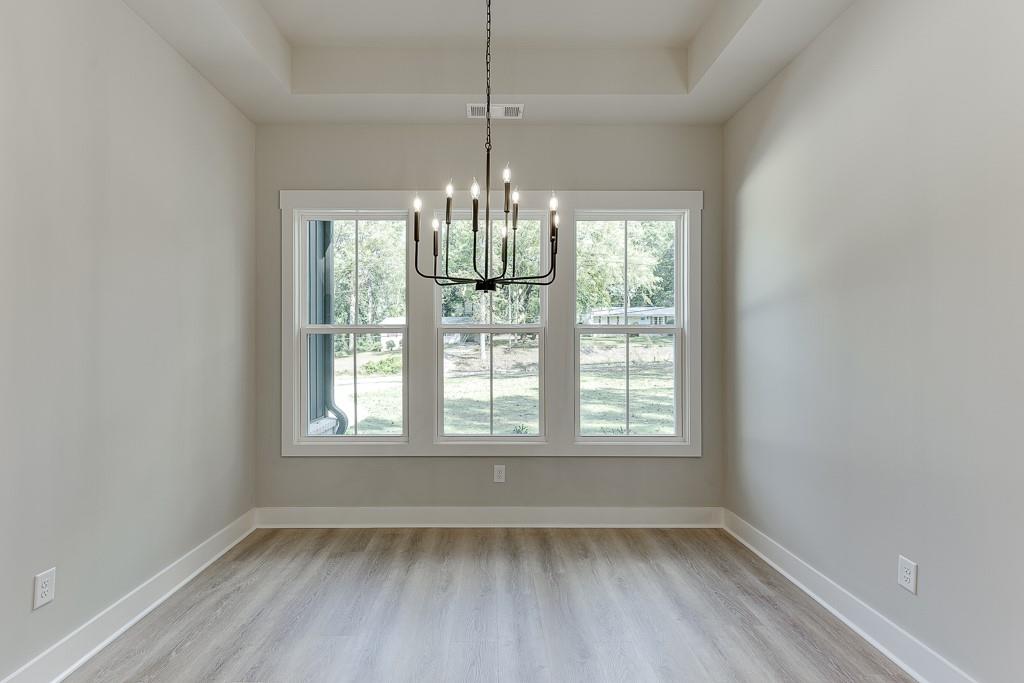 115 Rains Road Jefferson, GA 30549 - Photo 16 of 41 a view of an empty room with chandelier and window