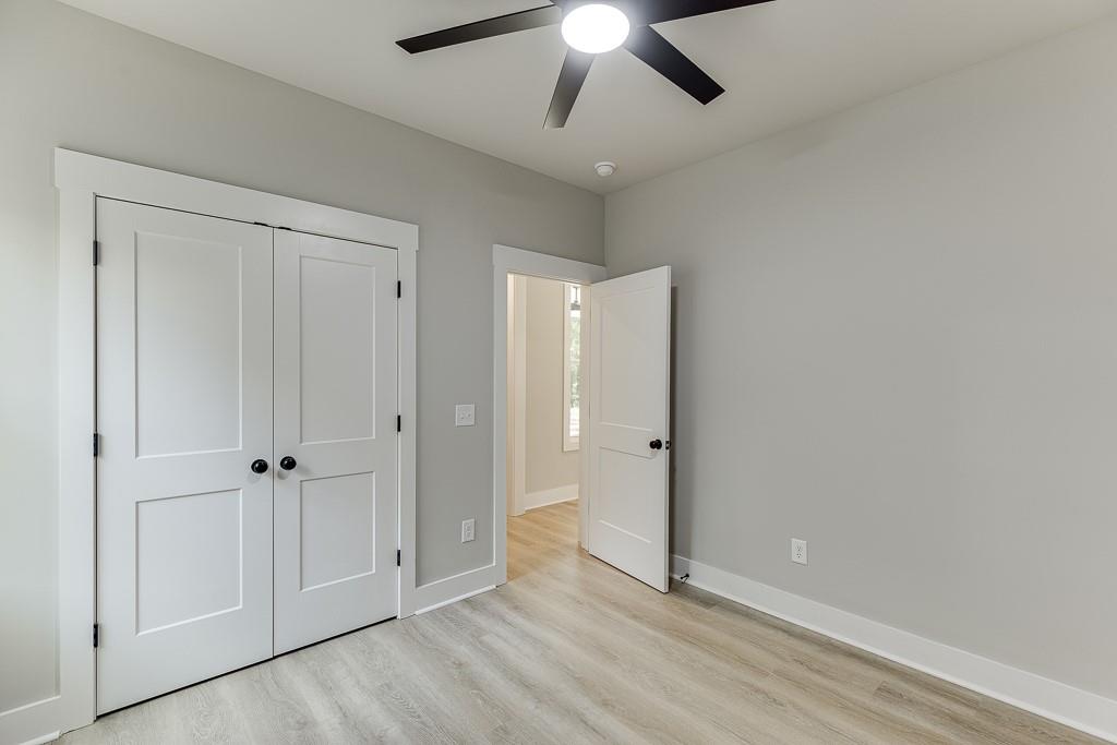 115 Rains Road Jefferson, GA 30549 - Photo 22 of 41 a view of an empty room with wooden floor