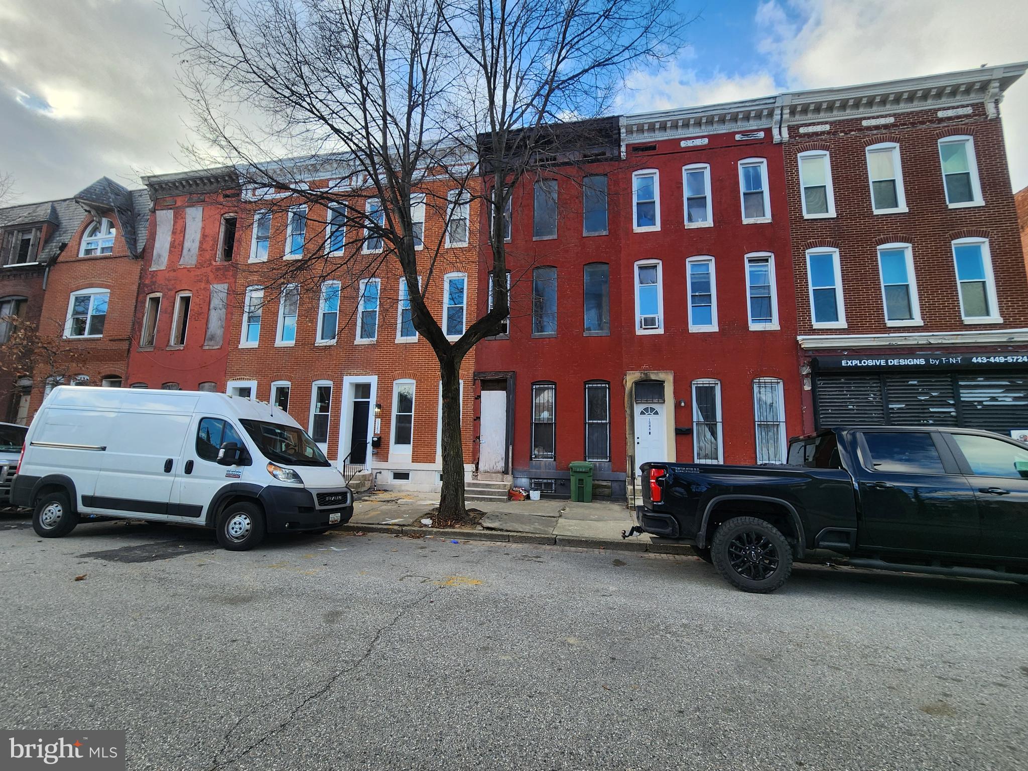 1344 Division Street Baltimore, MD 21217 - Photo 1 of 8 a car parked in front of a brick building