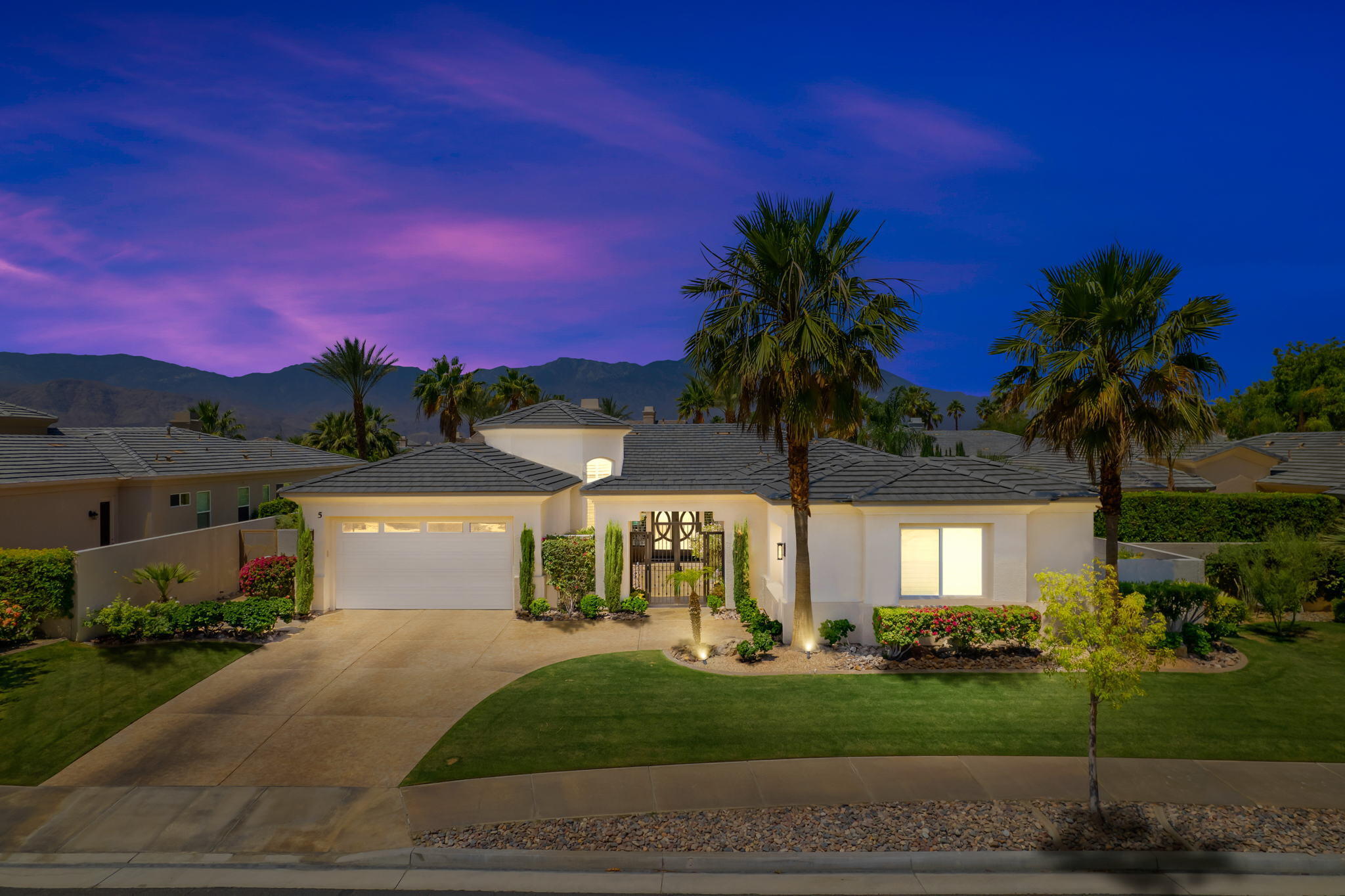 a view of a house with a yard and tree s