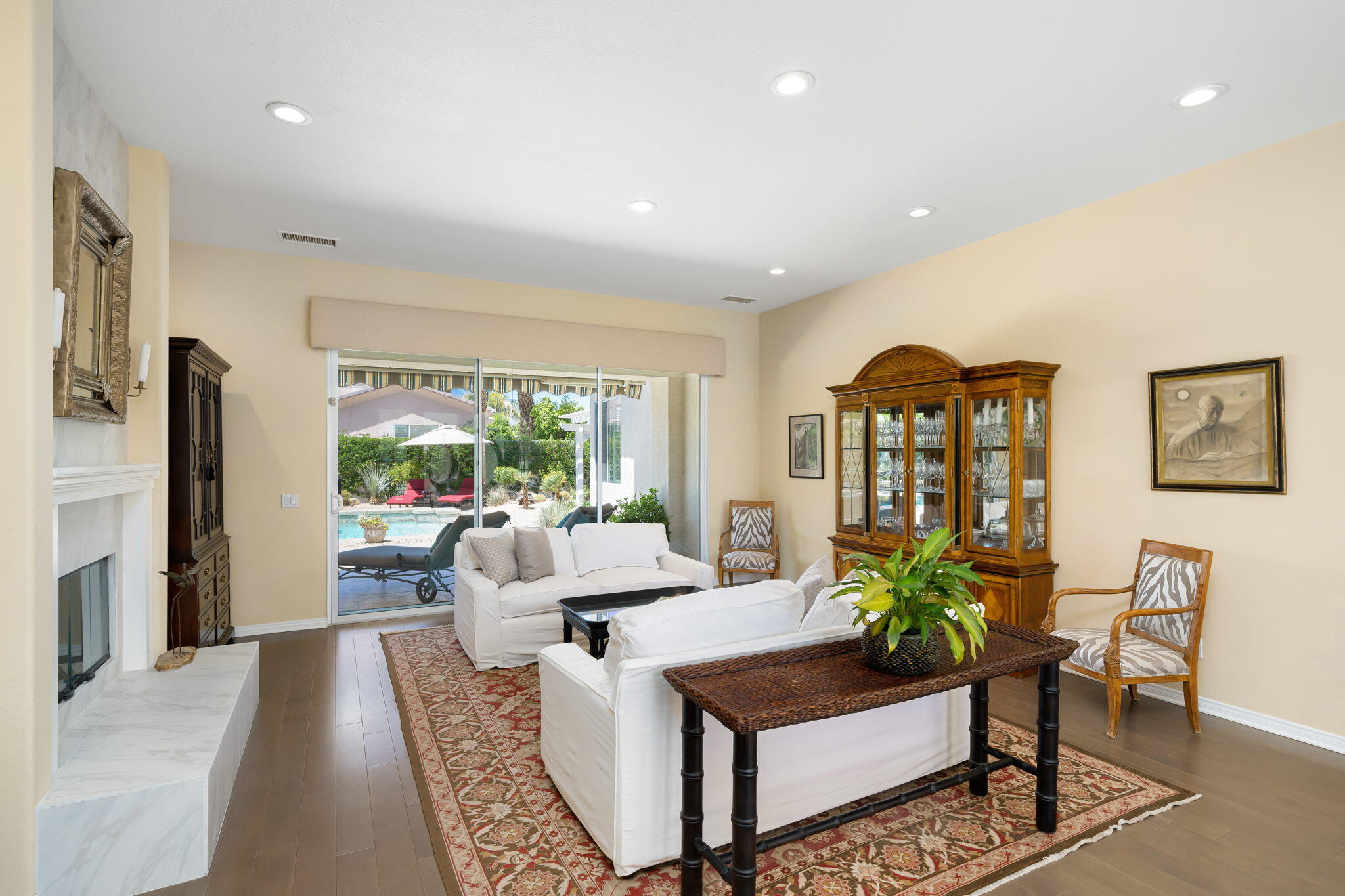 5 Lyon Road Rancho Mirage, CA 92270 - Photo 14 of 50 a living room with furniture a large window and a flat screen tv
