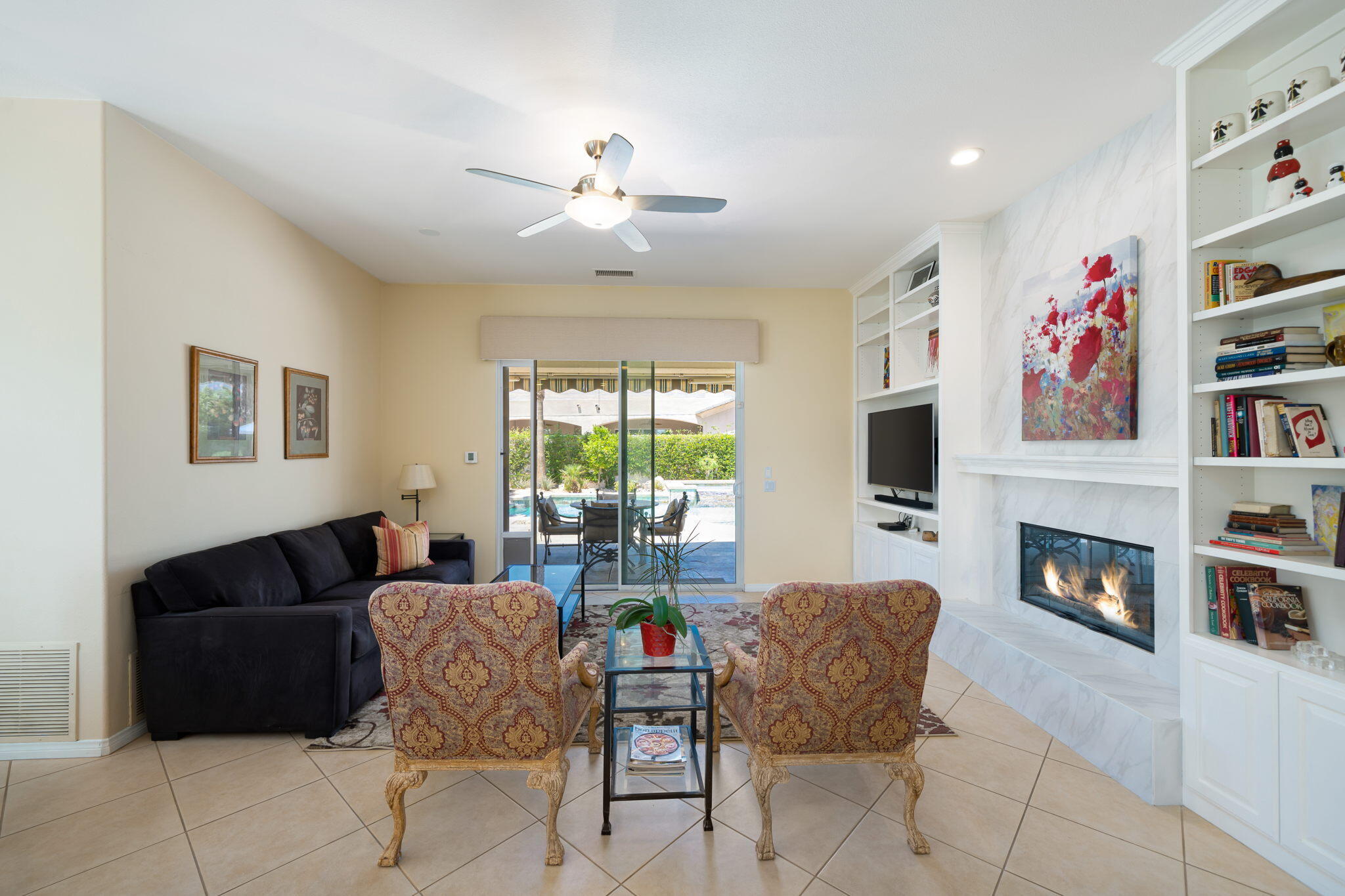 5 Lyon Road Rancho Mirage, CA 92270 - Photo 19 of 50 a living room with furniture and a fireplace or television