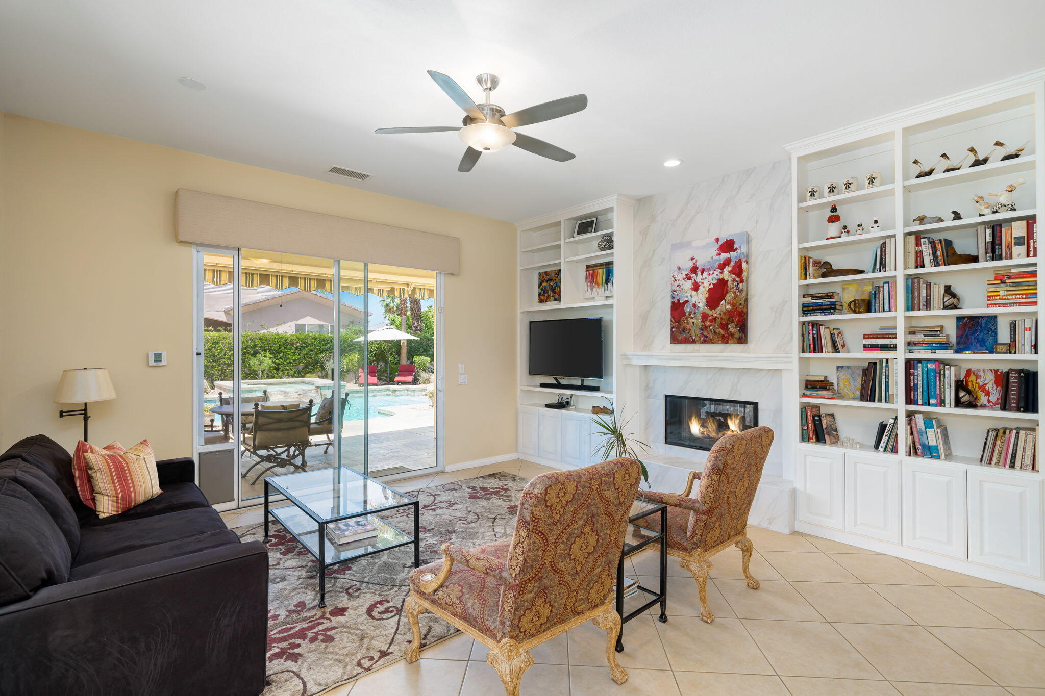 5 Lyon Road Rancho Mirage, CA 92270 - Photo 20 of 50 a living room with fireplace furniture and a flat screen tv