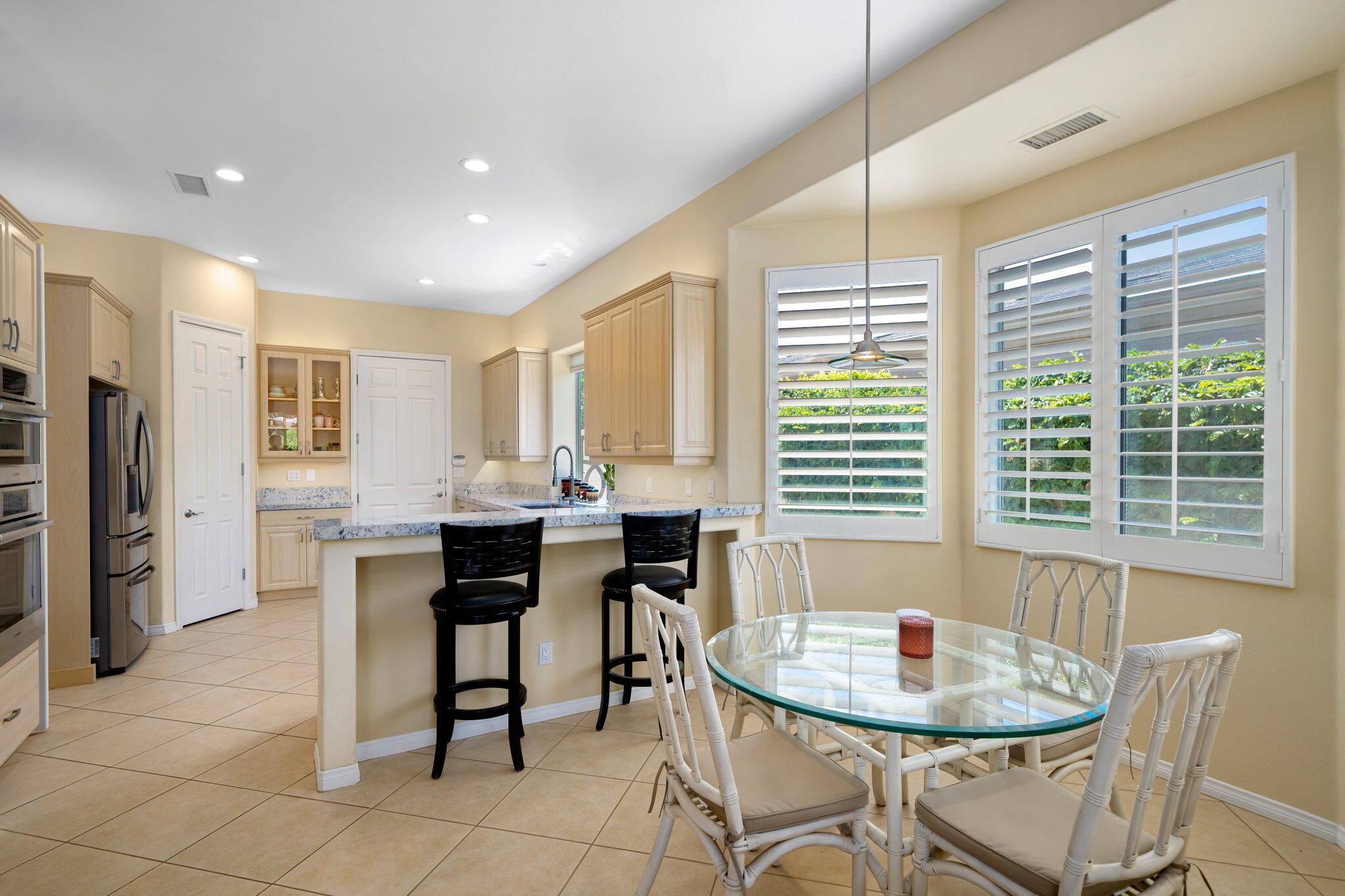 5 Lyon Road Rancho Mirage, CA 92270 - Photo 22 of 50 a dining room with furniture and window