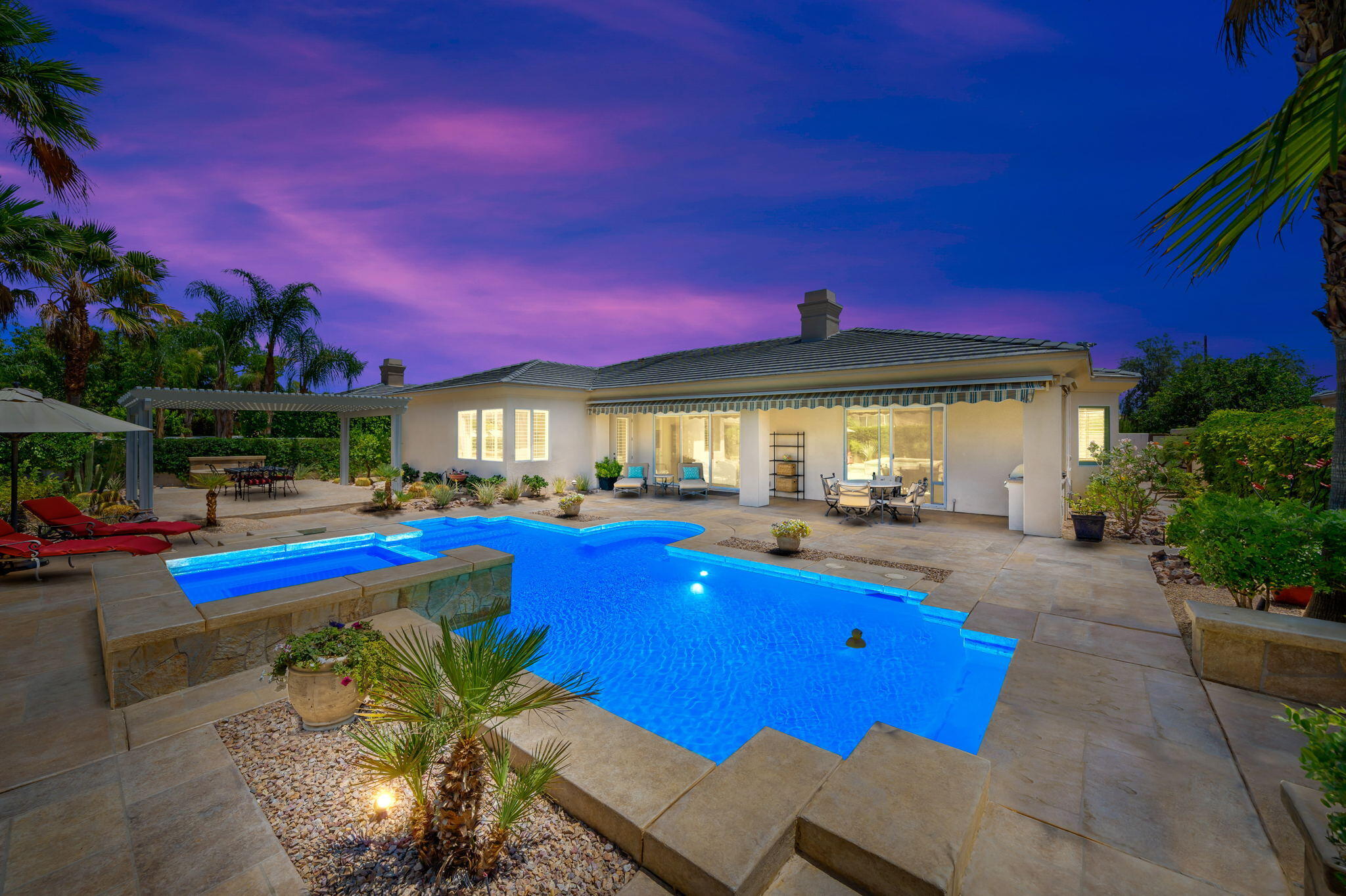 5 Lyon Road Rancho Mirage, CA 92270 - Photo 3 of 50 a view of house with swimming pool outdoor seating