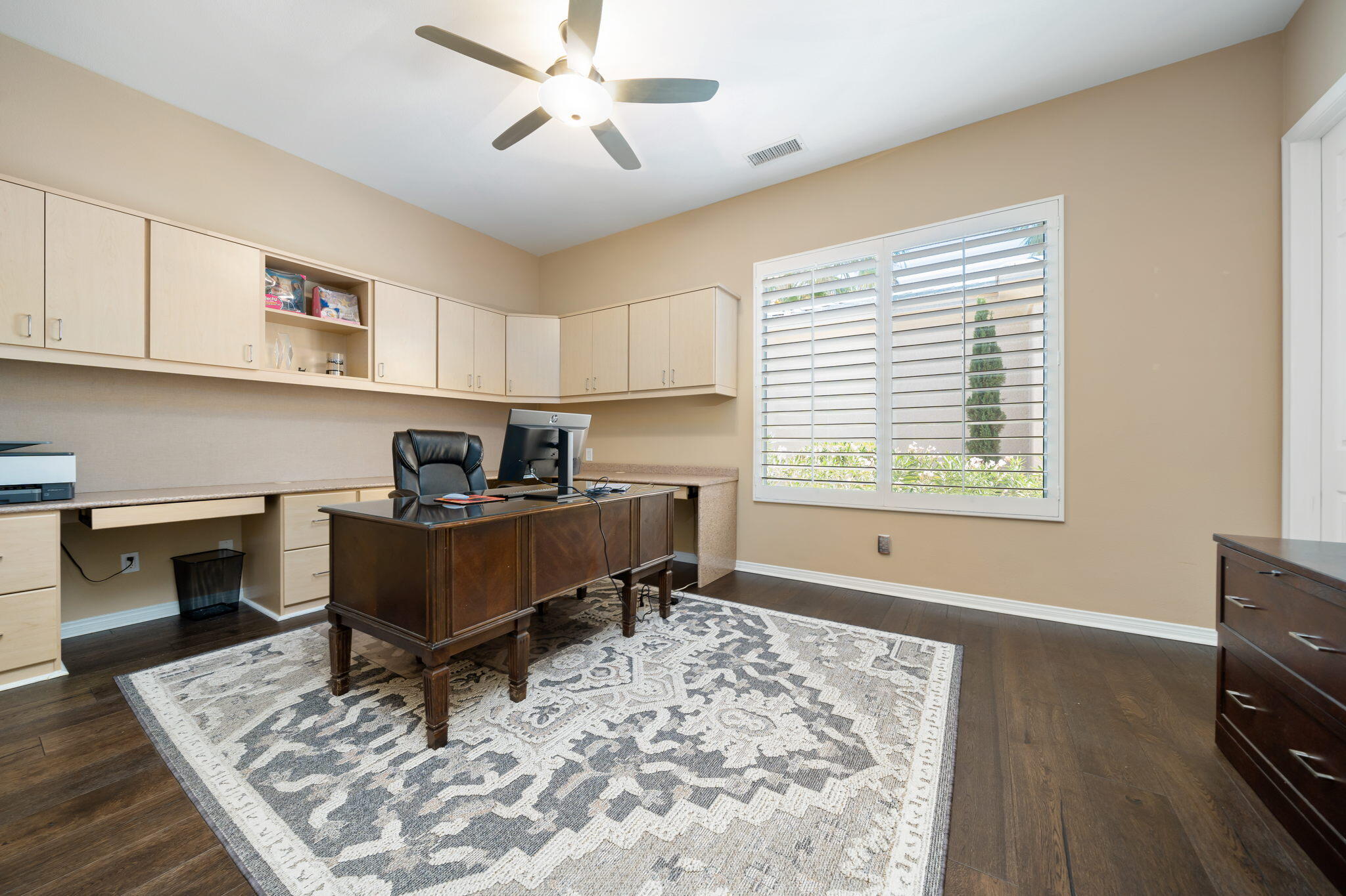 5 Lyon Road Rancho Mirage, CA 92270 - Photo 45 of 50 a living room with furniture and a wooden floor