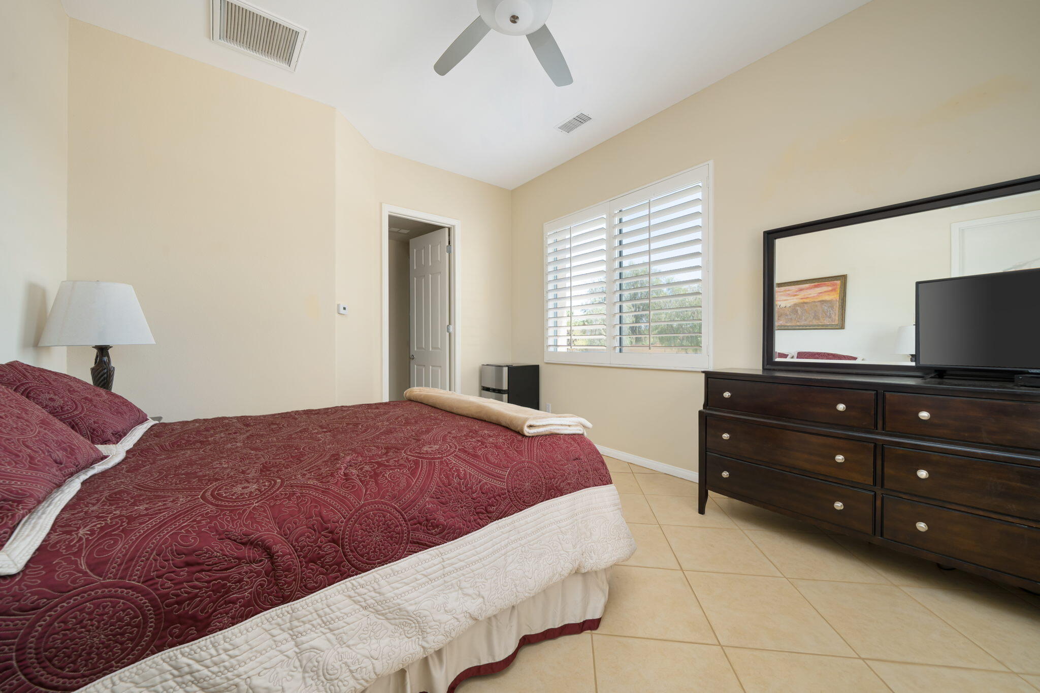 5 Lyon Road Rancho Mirage, CA 92270 - Photo 48 of 50 a bedroom with a bed and a television