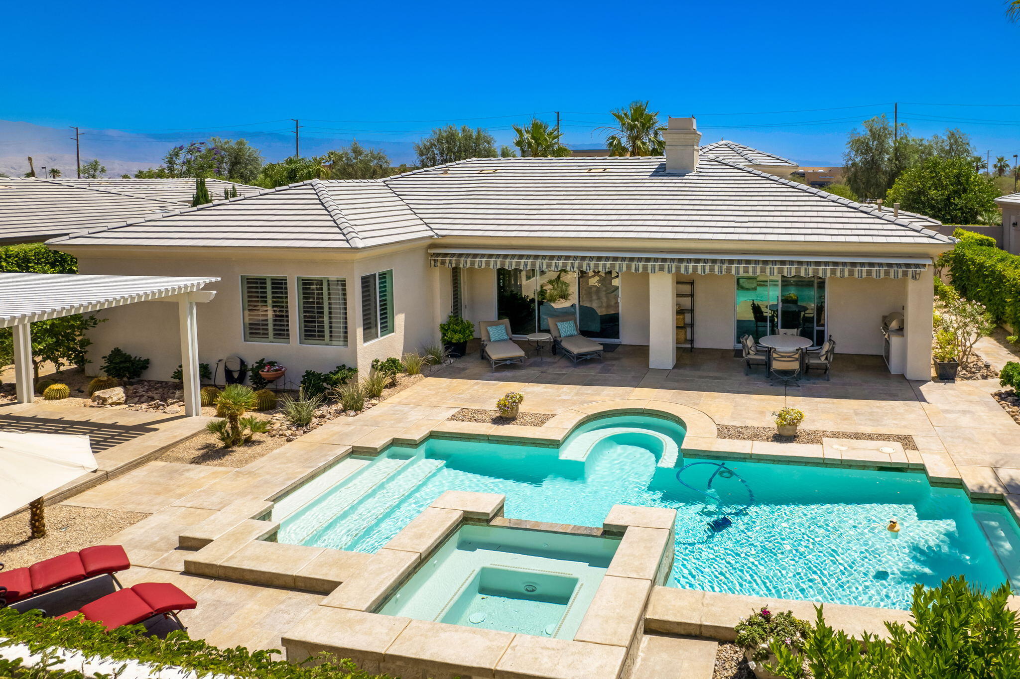 5 Lyon Road Rancho Mirage, CA 92270 - Photo 8 of 50 a view of a house with swimming pool and a patio