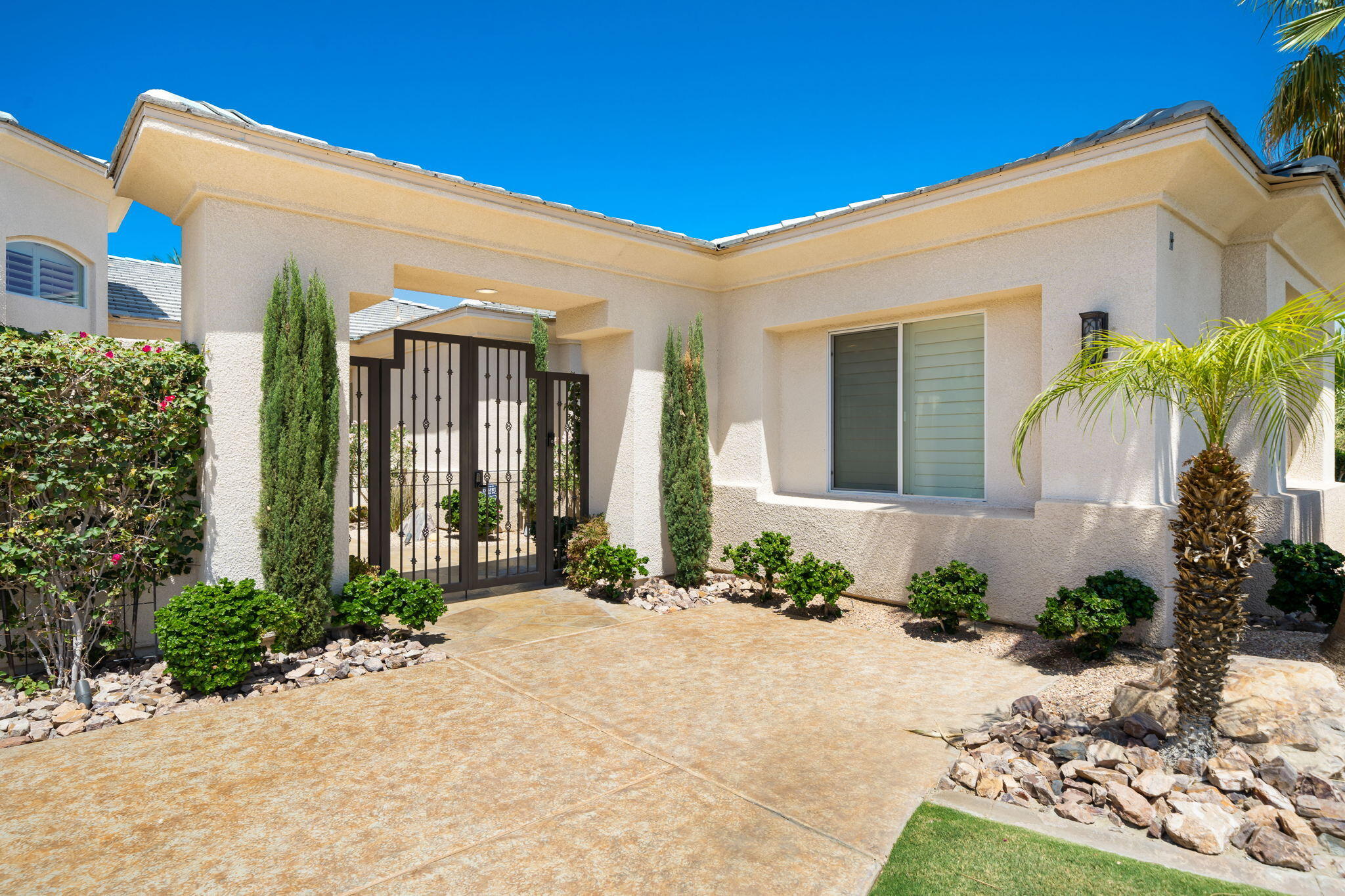 5 Lyon Road Rancho Mirage, CA 92270 - Photo 9 of 50 a front view of a house with garden