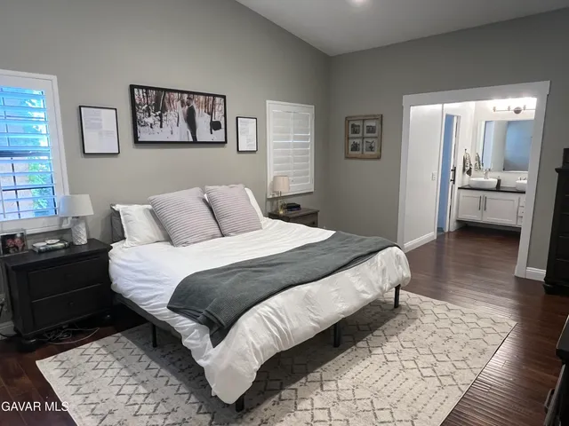 a bedroom with a bed and a couch