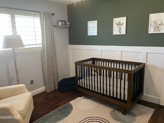 a bedroom with furniture and a window