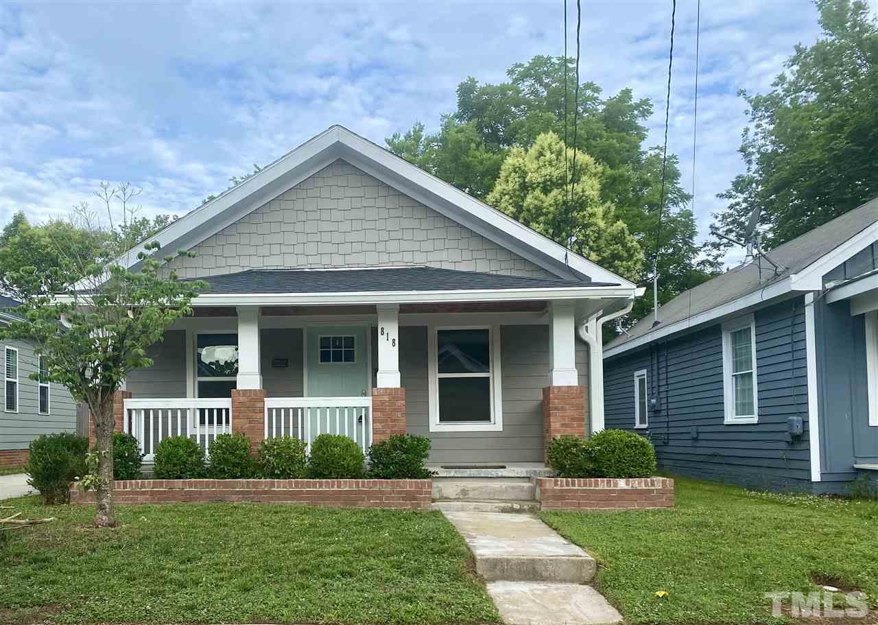 818 Ellington Street Raleigh, NC 27601 - Photo 1 of 20 front view of a house and a yard