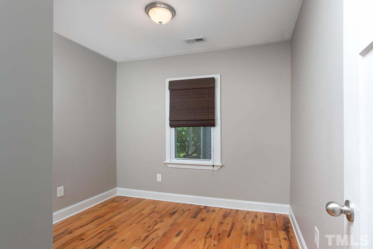 818 Ellington Street Raleigh, NC 27601 - Photo 13 of 20 a view of a room with wooden floor and window